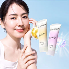 Woman holding a skincare product with Anessa bottles on a blue background
