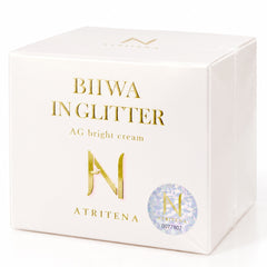 ATRITENA Biiwa in Glitter AG Bright Cream 50g Japanese SPF15 tone-up face cream-A white square box for Atritena BIIWA INGLITTER AG bright cream, featuring gold lettering and a holographic security sticker on the front, set against a plain white background. RENEWAL