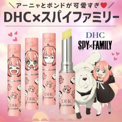 Four DHC lip cream tubes with anime character designs from Spy x Family, including a single open tube showing the pale yellow cream, set against a pink background with character illustrations.
