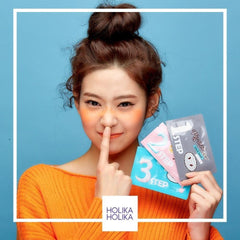 Woman holding Holika Holika skincare products 