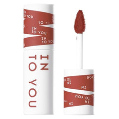 A liquid lipstick or lip gloss tube shown closed and open with the applicator wand, on a plain white background. The product packaging is white with diagonal rust-red bands and printed text reading 'IN TO YOU'.-INTO YOU SHERO SUPER MATTE LIP&CHEEK MUD 2G-EM08 BROWN-TAUPE/ BRICK RED NUDE-The Cosmetic Store