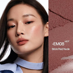 Close-up of a woman wearing a brick red nude lip color, shown alongside a textured color swatch labeled -EM08 HOT Brick Red Nude.-INTO YOU SHERO SUPER MATTE LIP&CHEEK MUD 2G-EM08 BROWN-TAUPE/ BRICK RED NUDE-The Cosmetic Store