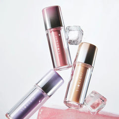 Three cosmetic bottles with pink, gold, and purple hues - JUDYDOLL Dual Flash Watery Lip Gloss 2.4g -09 Warm Dates-THE COSMETIC STORE NZ