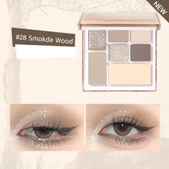 Eyeshadow palette with '28 Smoke Wood' shade and eye makeup application examples.- JUDYDOLL Play Color ALL-IN-ONE Eyeshadow Palette  8.5g-28 Smoky Wood-THE COSMETIC STORE NZ