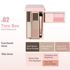 Taro Box makeup palette set in a pale pink box, shown open with a brow pencil, contour stick, brush, and a four-color eyeshadow palette. Text on the left reads '#02 Taro Box (with Mascara)' and includes shade callouts for dark brown brow powder, gray-brown contour, gray-pink eyeshadow, matte pale pink highlight, strawberry pink brightener, and rose-pink accent shade.