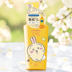 A bottle of softymo rabbit-themed deep cleansing gel, featuring a bright yellow body with a cute cartoon bunny illustration and a matching pump dispenser, set against a soft-focus background of white blossoms.