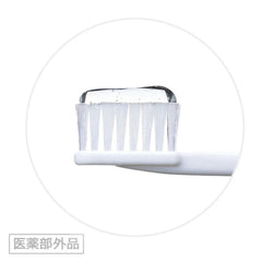A close-up of a white toothbrush head with translucent white bristles and a clear toothpaste smear, centered inside a thin circular frame on a white background. LION Dent Check-Up Gel -Banana-THE COSMETIC STORE NZ