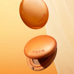 Two orange TIRTIR products on a beige background