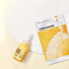 A skincare set featuring a small dropper bottle of Moisture Barres Ceramide moisturizer and its corresponding sachet packaging, styled on a clean white background.- Mediheal Ceramide Essential Mask Moisture Barrier 10pcs-The Cosmetic Store nz.