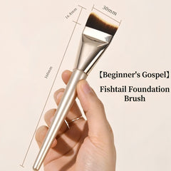 Fishtail foundation brush held in a hand with measurements and brand name 