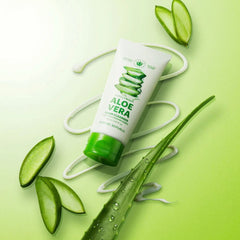 Tube of aloe vera cleanser with aloe vera leaves on a green background