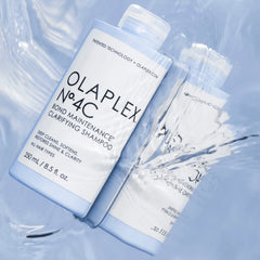 Olaplex shampoo bottles with water droplets -Olaplex No.4C Bond Maintenance Clarifying Shampoo 250ml-THE COSMETIC STORE NZ.