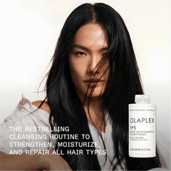 Person with long black hair next to an Olaplex bottle -Olaplex No.5 Bond Maintenance Conditioner 250ml-THE COSMETIC STORE NZ.
