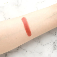 The Cosmetic Store -Canmake Cream Cheek - 16 Almond Terracotta-Red lipstick swatch on a person's arm 
