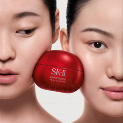 Two faces with a red SK-II cream container between them on a light background-Woman holding an SK-II skincare product -SK-II Skinpower Airy Cream 50g | Anti Aging Moisturiser NZ