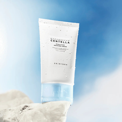 Cenella cream tube with a blue sky and clouds in the background