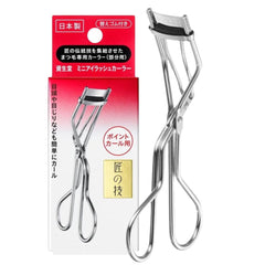 Eyelash curler with packaging on a white background
