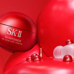 Woman holding an SK-II skincare product -SK-II Skinpower Airy Cream 50g | Anti Aging Moisturiser NZ