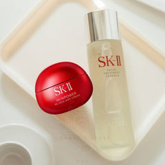 SK-II skincare products including a red cream and a facial treatment essence on a light background-SK-II Skinpower Re-New Airy Cream 50g-The Cosmetic Store NZ.