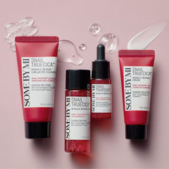SOME BY MI Snail Truecica routine texture with black snail mucin- Four skincare products from SOME BY MI, including two Snail TrueCica Miracle Repair Low pH Gel Cleansers, one Snail TrueCica Miracle Repair Ampoule, and one Snail TrueCica Miracle Repair Cream, arranged on a pink background with decorative clear gel droplets.-THE COSMETIC STORE NZ.