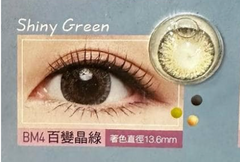 Advertisement for shiny green contact lenses with an eye and lens close-up.