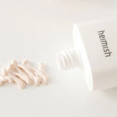 White skincare product with 'heimish' branding on a light background