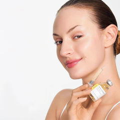 Woman holding a skincare product -SUNGBOON Deep Collagen Silk Peptide Intensive Ampoule with a syringe -THE COSMETIC STORE NZ
