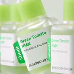 Green Tomato NMN skincare ampoules with visible brand labels on a green checkered background.