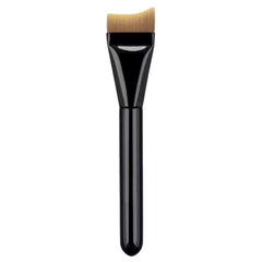 Makeup brush with black handle and beige bristle head on a white background