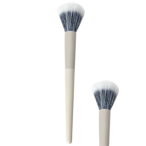 Two makeup brushes with white handles and black and white bristles on a white background