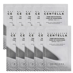 Multiple boxes of Madagascar Centella sunscreen with branding on a white background