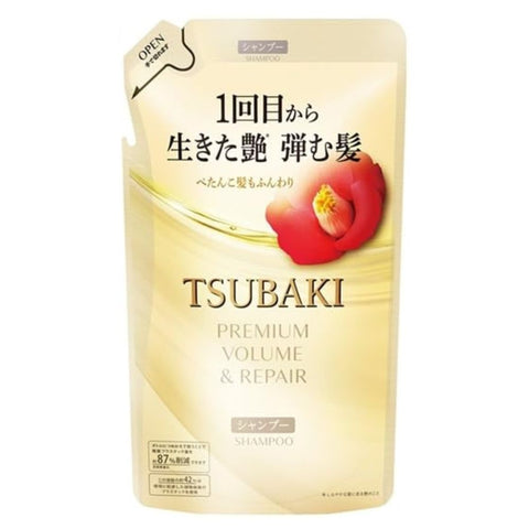 Tsubaki shampoo bottle with a red apple on a white background