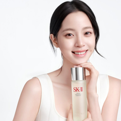 Woman holding an SK-II skincare product against a white background-SK-II Facial Treatment Essence bottle and red box 75ml [Japan Domestic Versions]-available at The Cosmetic Store NZ