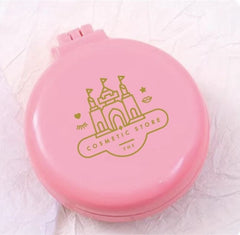 Pink cosmetic case with castle design on a light pink background