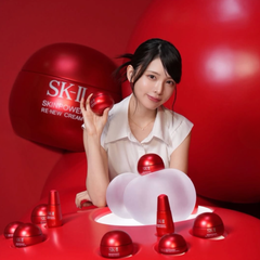 Woman holding an SK-II skincare product -SK-II Skinpower Airy Cream 50g | Anti Aging Moisturiser NZ