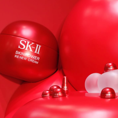 Woman holding an SK-II skincare product -SK-II Skinpower Airy Cream 50g | Anti Aging Moisturiser NZ