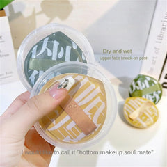Hand holding a container of face masks with text overlay on a light background