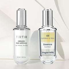 Two skincare bottles labeled 'TIRTIR Ceramic Milk Ampoule' and 'Vegan Milk Essence' on a light background.