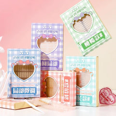Set of cosmetic product boxes with heart-shaped designs on a pink background