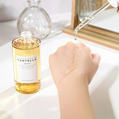 Bottle of 'Naturals Centella' ampoule with dropper on a white surface