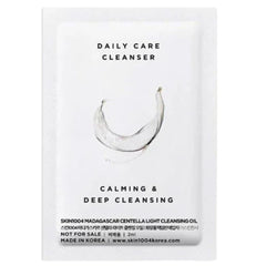 Skincare sample with 'Daily Care Cleanser' text on a white background