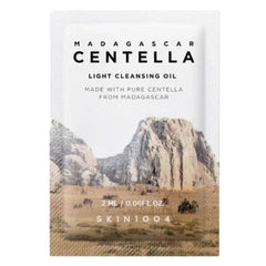 Packaging of Madagascar Centella light cleansing oil with mountain landscape design.