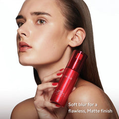 Woman holding a red skincare product with text about finish