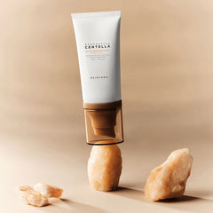 Skincare tube with natural elements on a beige background
