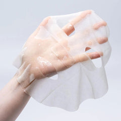 Premium embossed cotton sheet mask texture from the Kose Clear Turn anti-aging collection.