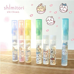 Six Shimitori Chiikawa clear plastic spray bottles with colorful caps and cute character illustrations, arranged on a wooden surface against a white background with character graphics.
