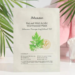 JM solution ReLeaf Mild Acidic Wormwood Mask packaging with green leaves on a light background