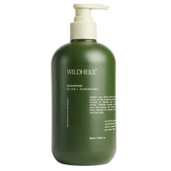 A 500ml pump bottle of Wildheke Olive + Kawakawa Shampoo, featuring a matte dark olive green bottle and a cream-colored pump dispenser, set against a plain white background.- Wildheke Natural Shampoo Olive and Kawakawa 500ml pump bottle at The Cosmetic Store