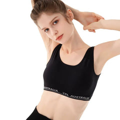 Woman wearing a black sports bra with 'YPL Australia' Branding. YPL Vanish Training Bralette – Seamless Sports Bra for Yoga & Fitness