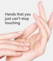 Close-up of hands with text 'Hands that you just can't stop touching' on a light gray background